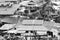 Aerial black and white image of old slum or packed housing units for poor people.