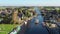 Aerial from boats cruising through the village Echtenerbrug in Friesland Netherlands