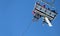 Aerial bottom view of ski lift with skier with blue sky