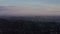 AERIAL: Breathtaking View over Hollywood Hills with Los Angeles Cityscape in Beautiful Sunset Light