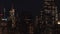 Aerial: breathtaking wide view the iconic Empire State Building disappearing behind residential condominiums and office