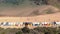 Aerial of Brighton Bathing Boxes in Melbourne facing sea, dolly left movement