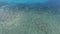 Aerial: calm cristal clear sea blue water background. hd 1080.
