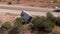 Aerial of camper caravan crashed on a highway accident in a desert rural area. Motorhome crashing event on the motorway