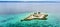 Aerial of Capitancillo Islet, a small coral island near Bogo, Cebu. A white lighthouse