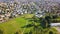 Aerial Capture of Trondheim City, Norway - Sunny Summer Day, Starting Movement From the Fjord to City, over Water