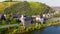 Aerial of Castle of the Leyen, road passing castle Wasserburg near Kobern Gondorf on the Moselle River, Germany.