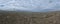 Aerial Cinematic slow motion shot of Drone Flying over a large herd of wild horses galloping fast across the steppe.