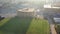 Aerial cinematic view of a construction site in Los Angeles at sunrise