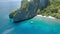 Aerial circle fly above coral reef and banca boats at the beach of Entalula Island, Bacuit Bay, El-Nido. Palawan Island