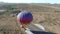 Aerial circling hot air balloon landing in desert