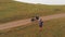 Aerial circular view happy joyful caucasian male cyclist standing by red touring bicycle looking