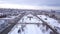 Aerial of the city covered in snow. Clip. Top view of the snow-covered Russian city