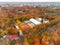 Aerial city park, railway, tennis courts in autumn