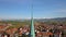 Aerial cityscape of a huge german town with old tower top on the foreground, 4k