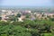 Aerial cityscape view of Moshi city buildings with green trees and houses in Tanzania