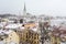 Aerial cityscape view of Tallinn Old Medieval Town on winter day. St. Olaf`s Church spire visible in the distance