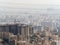 Aerial cityscape view of Tehran with multiple power lines crisscrossing through the sky in  Iran