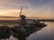 Aerial of classic dutch windmills at the Zaanse Schans during a stunning sunrise