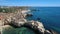 Aerial. Cliffs and beaches of the coast of Albufeira filmed from the sky.