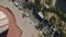 Aerial: close overhead drone shot of Barcelona, Spain Rooftops in Sunlight with Traffic on streets