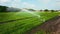 Aerial close up clip of an agricultural irrigation system in operation