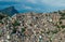 Aerial close up of favela spread out on the mountain