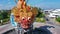 Aerial close up roundabout with fish statue with barong head in Pelabuhan Benoa harbor in Bali