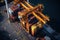 Aerial close up view of a cargo terminal on the pier of industrial seaport. Port cranes load containers on board a cargo