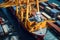 Aerial close up view of a cargo terminal on the pier of industrial seaport. Port cranes load containers on board a cargo