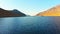 Aerial close up view over alpine lake in tranquil countryside in caucasus mountains