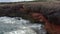 AERIAL: Close Up of Waves crashing intro Rocks, Cliff, Coast on Sunny Day on Mallorca Island Sunny Weather, Sunshine