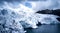 Aerial closeup view of Pastoruri glacier entering the lake