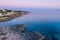 Aerial coastline sunset over mediterranean sea. Purple sky.