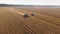 Aerial combine working on wheat field