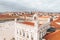 Aerial of Commerce Square, Lisbon with the orange roofs and unique statues on top of buildings