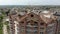 Aerial Construction of a brick house. Installation of wooden roof