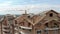 Aerial Construction of a brick house. Installation of wooden roof