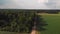 Aerial of countryside with dirt road and wind mills