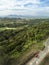 Aerial of the countryside of Nasugbu, Batangas. A red van is parked at a rural road