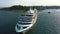 Aerial: cruise ship departs from pier, Large liner sailing in Mediterranean sea