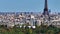 Aerial descending footage of tourist sights in historic city center. Revealing trees in large park. Paris, France