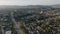 Aerial descending footage of vast residential neighbourhood. Heavy traffic on Hollywood Freeway and houses at golden