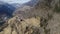 Aerial of destroyed forest. Wind damaged woods in the Alps. Flying over snapped trees