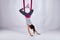 Aerial different inversion antigravity yoga in a hammock