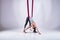 Aerial different inversion antigravity yoga in a hammock