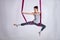 Aerial different inversion antigravity yoga in a hammock