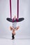 Aerial different inversion antigravity yoga in a hammock