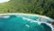 Aerial dolly descent over emerald lagoon Anse Cocos beach, La Digue