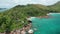 Aerial dolly descent to amazing beautiful Petite Anse Lazio beach